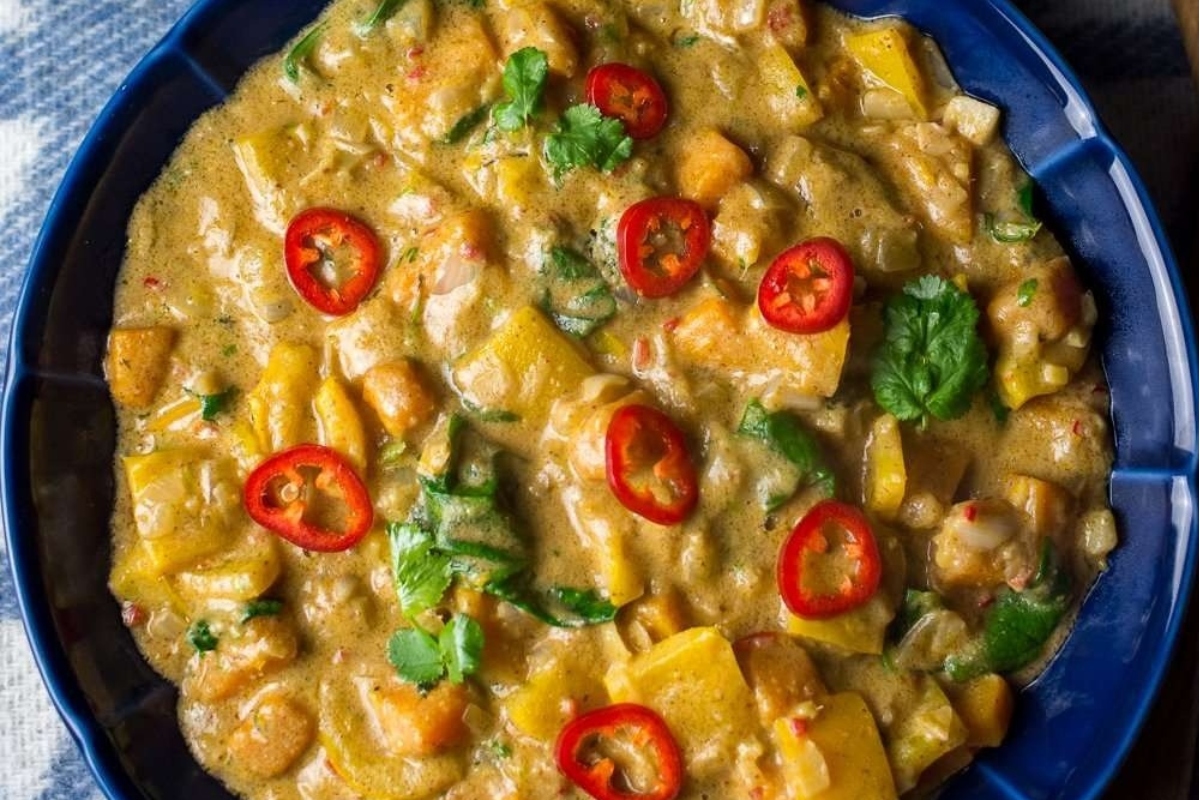 A hearty stew of curry with an array of colorful vegetables and fragrant spices.