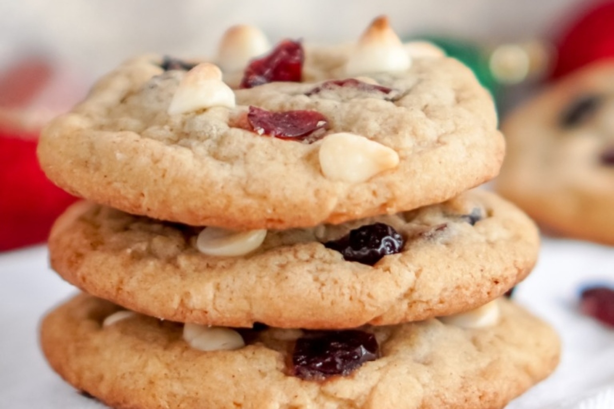 A delicious cranberry and white chocolate snack made with a stack of cookies.