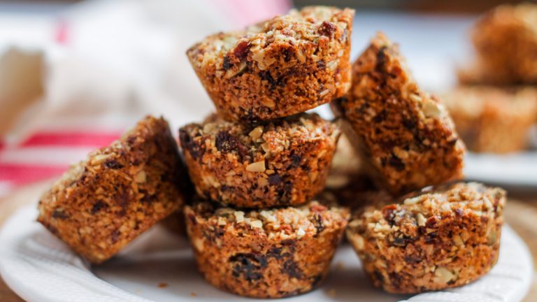 A stack of Aussie Bites copycat recipe granola muffins on a plate.