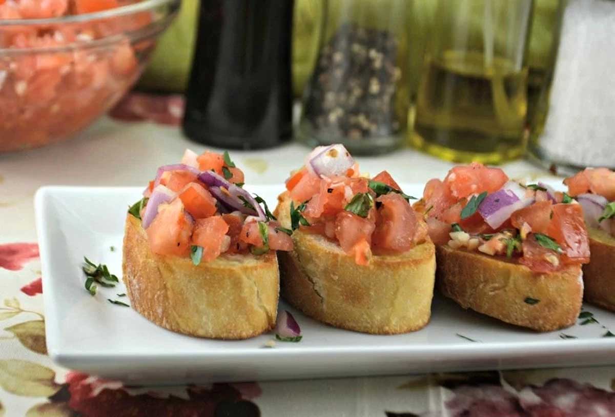 Italian crostini on a white plate.
