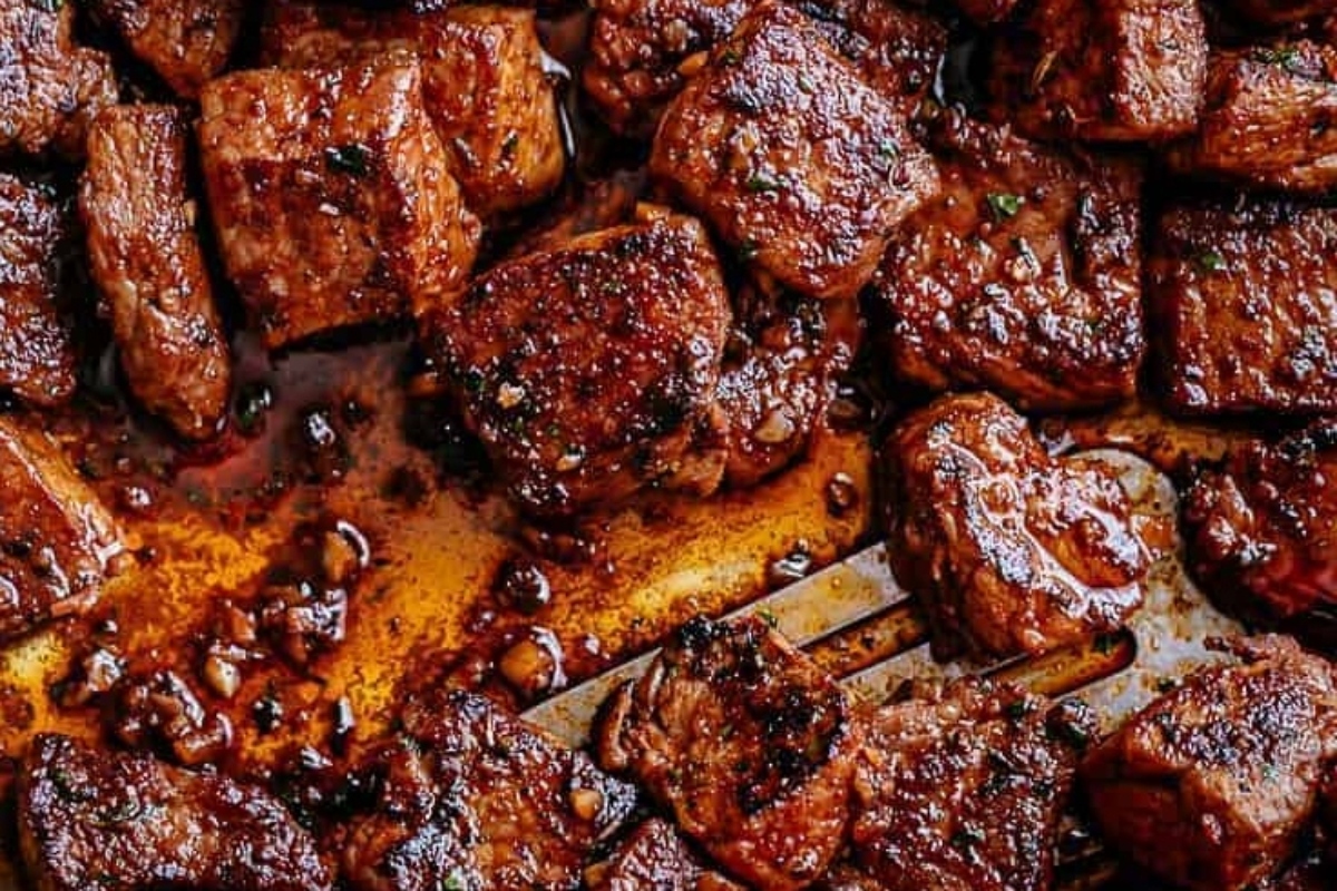 Christmas bbq pork chops on a baking sheet with a fork.