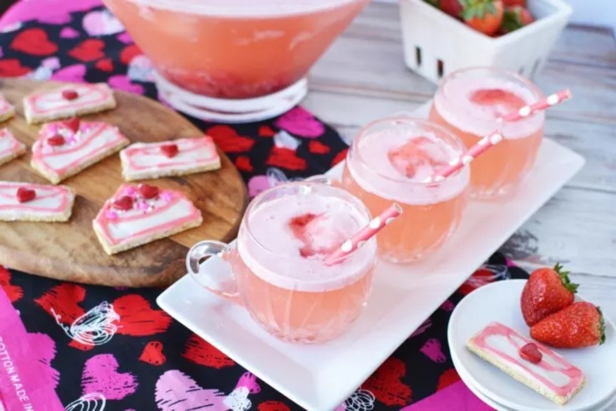 Valentine's Day cocktail with strawberries and cookies.