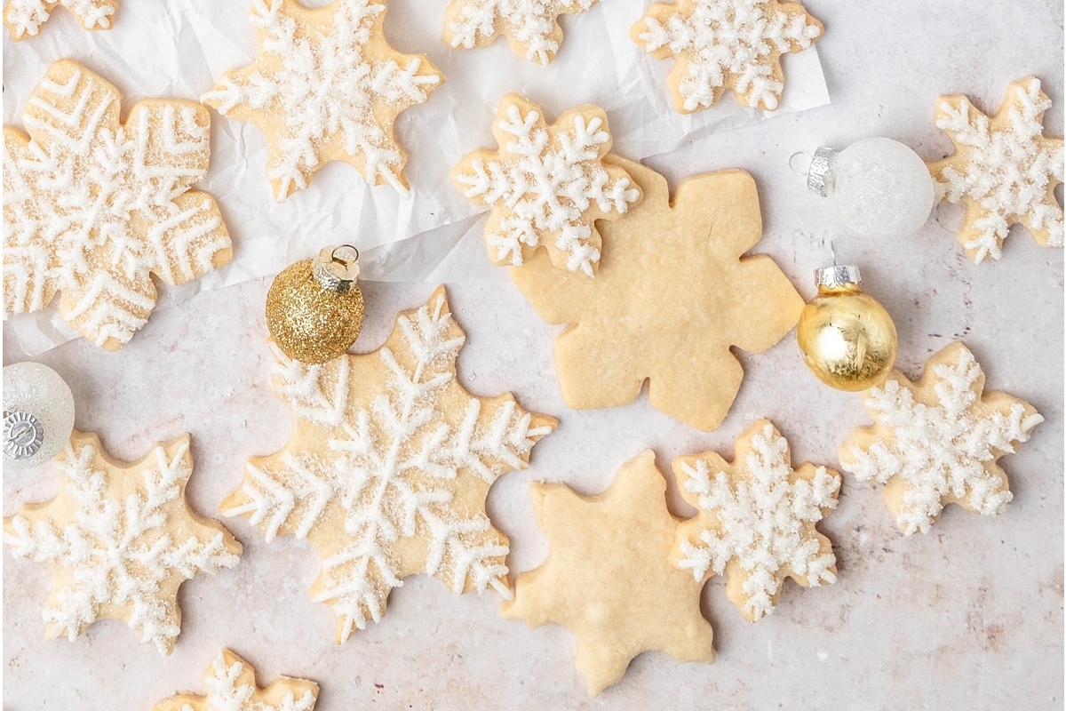 Christmas sugar cookies on a white surface.