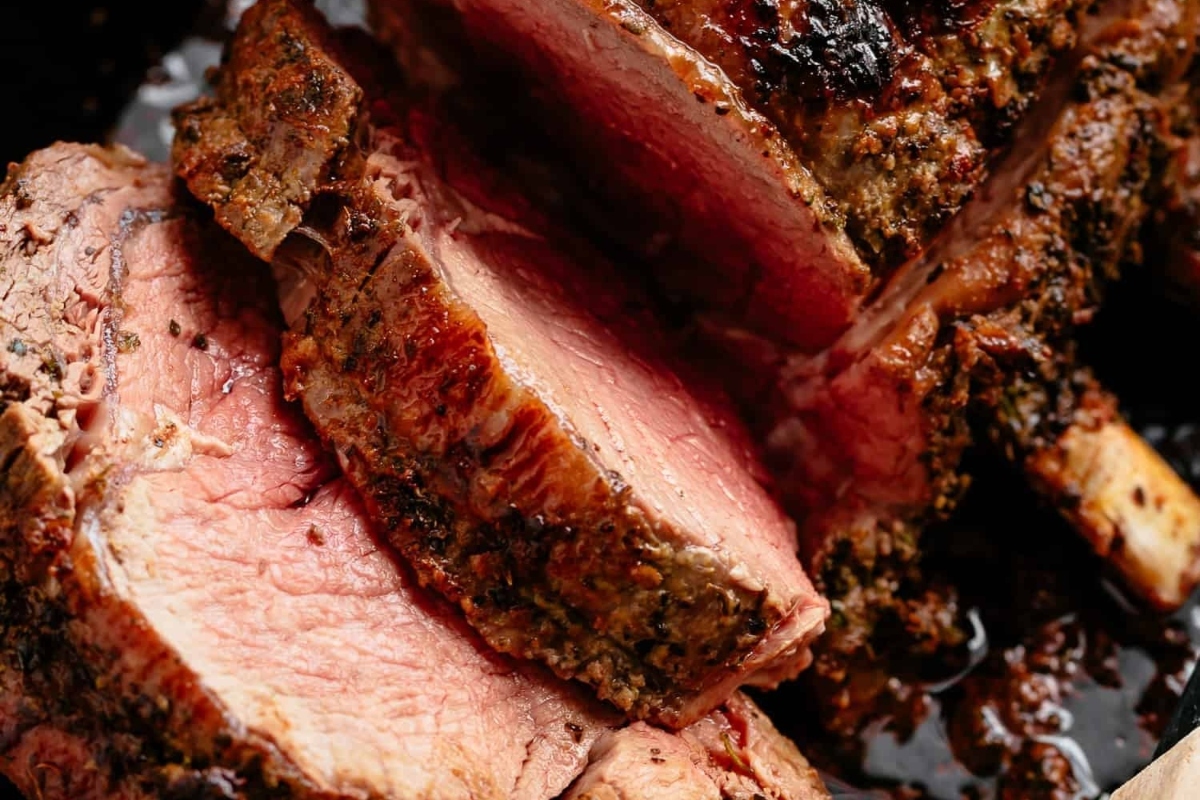 A close up of a beef roast in a pan.