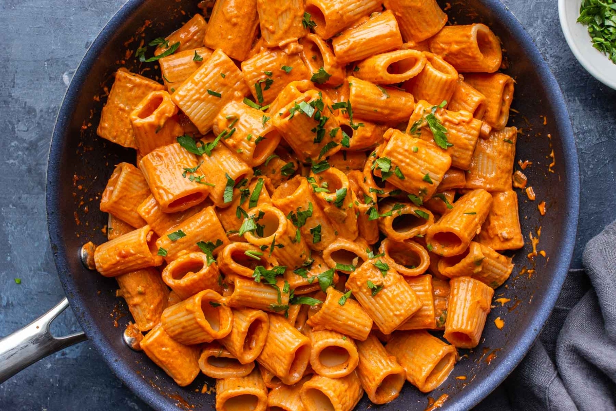 Quick and easy Gigi Hadid Pasta with sauce in a skillet on a dark background.