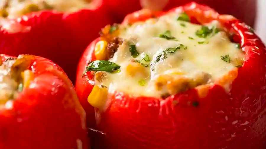 Stuffed peppers with melted cheese.