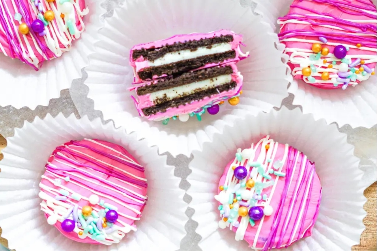 Valentine's Day Oreos with pink frosting and sprinkles.