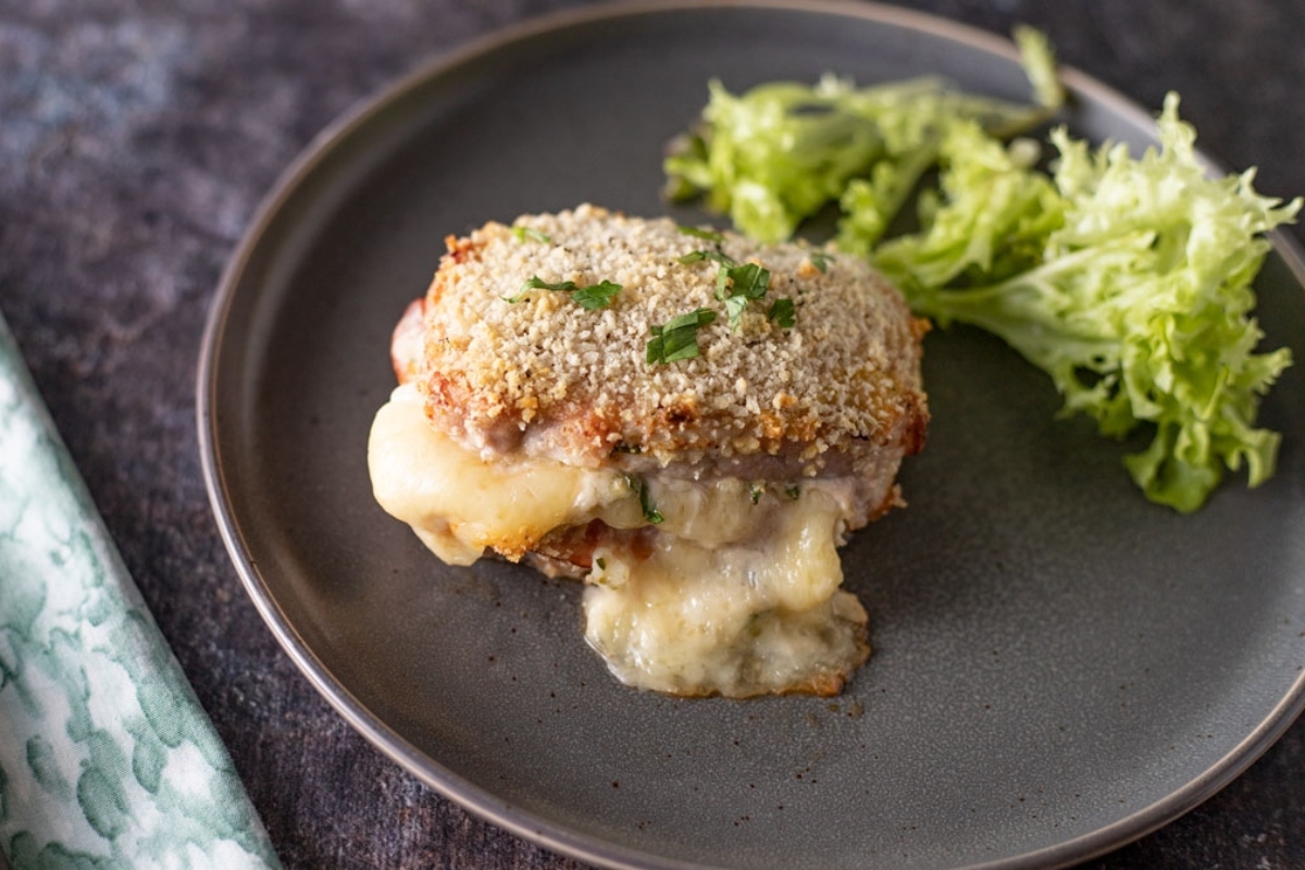 A plate with a cheesy winter dish on it.