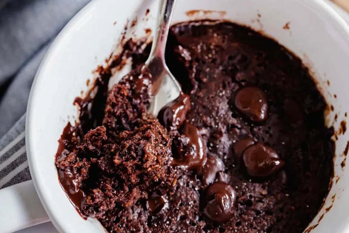 Mug cake in a white bowl with a spoon.