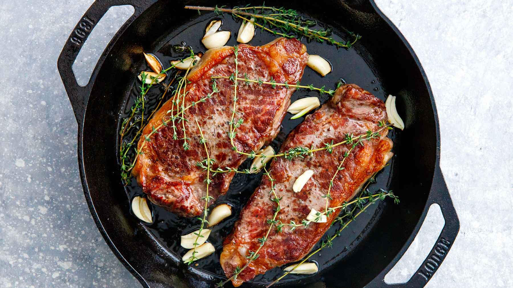 Sear steak with thyme and garlic.