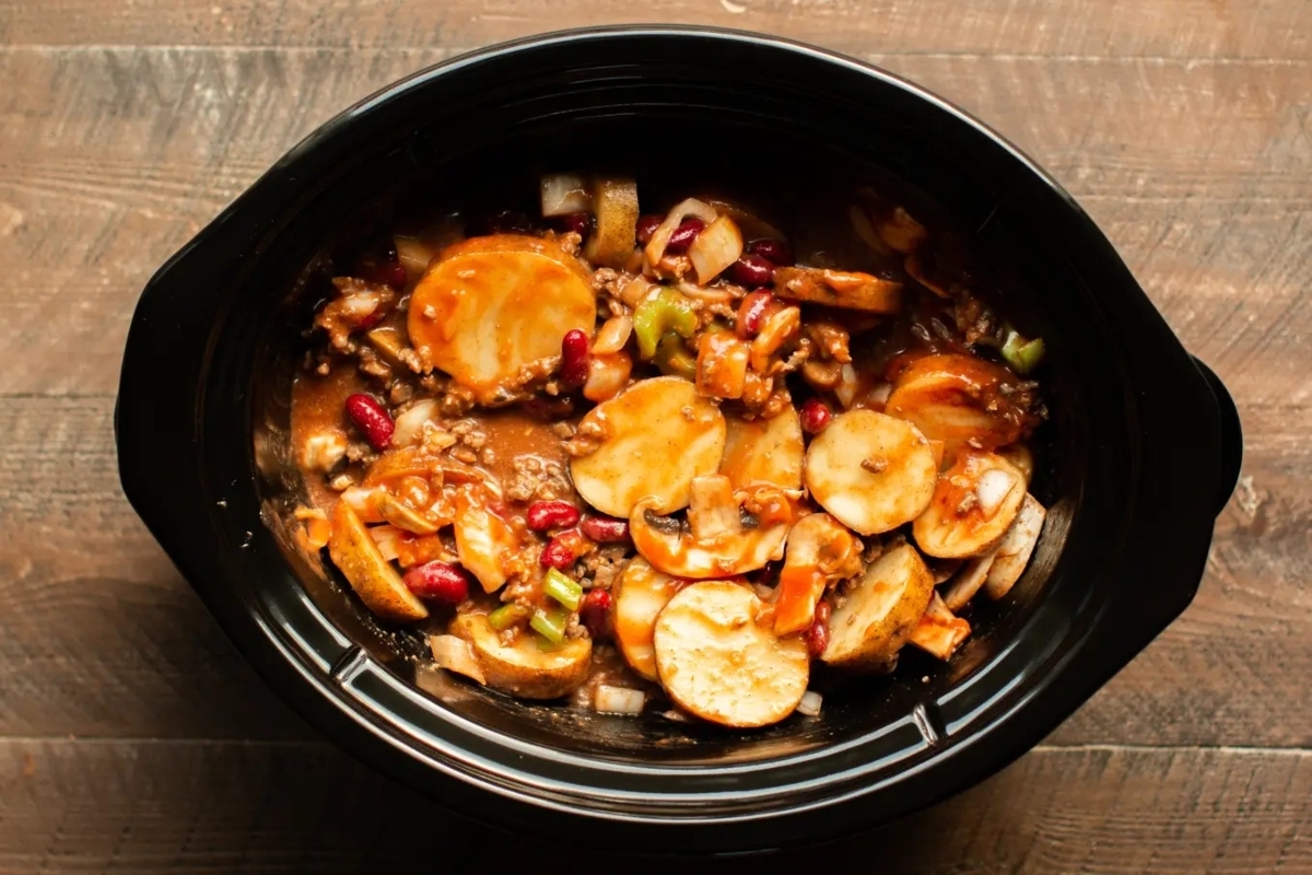 A slow cooker filled with stews.