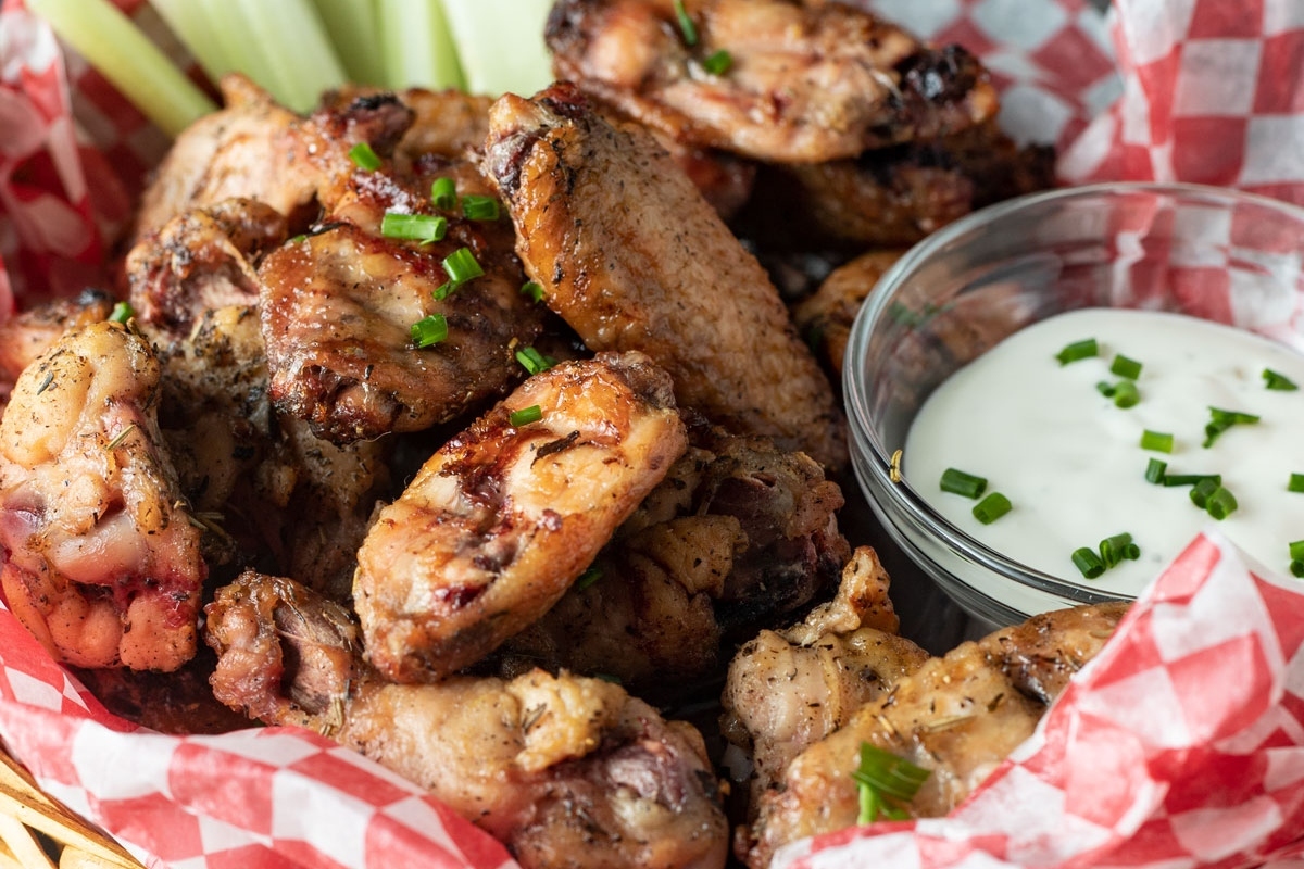 Grilled chicken wings in a basket, perfect for Game Day.
