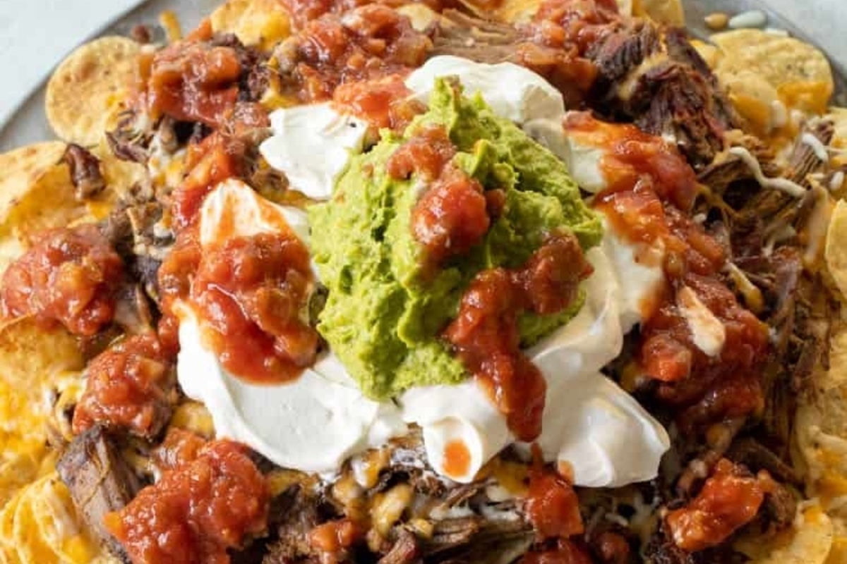 Easiest Game Day Recipes: Mexican Nachos with Guacamole and Sour Cream.