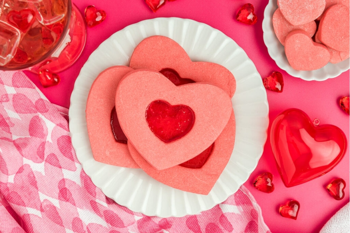 Valentine's Day cookies arranged beautifully on a pink plate.