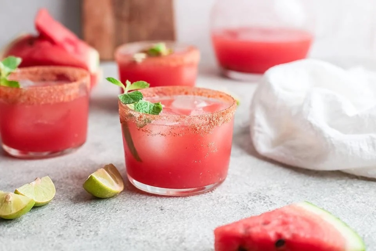 Refreshing watermelon margarita infused with zesty lime and aromatic mint, perfect for Valentine's Day cocktails.