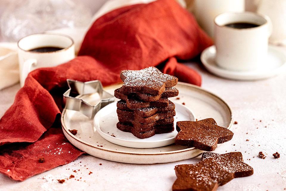 Christmas Cookies on a plate with a cup of coffee.