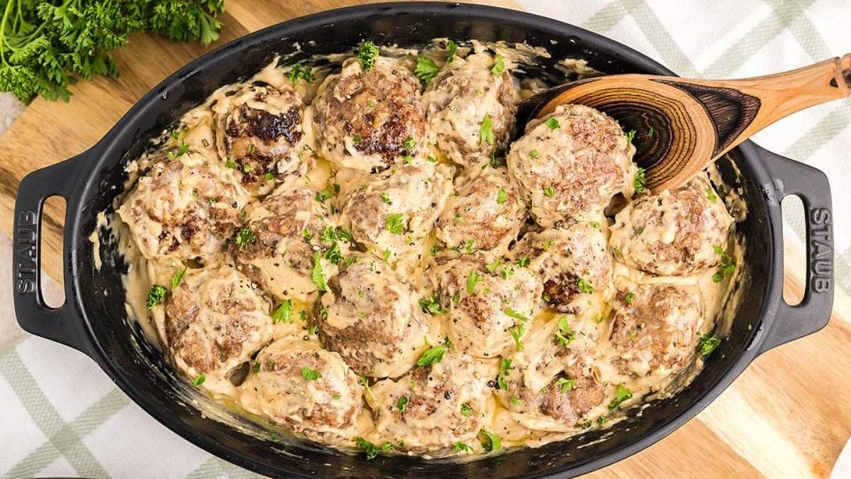 A comforting skillet of meatballs and gravy, perfect for sharing.