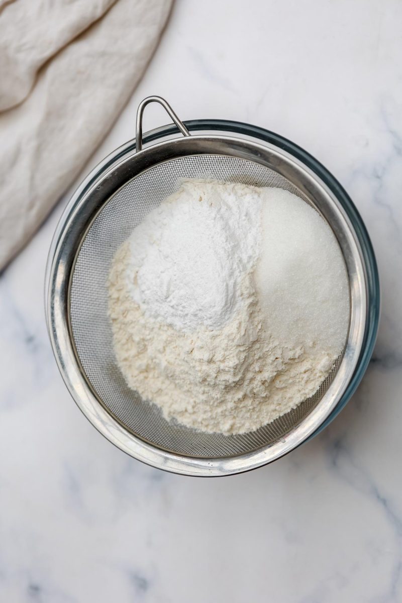 Sifting flour.