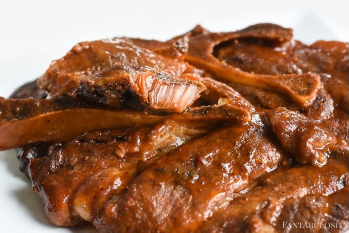 Bbq ribs on a white plate.