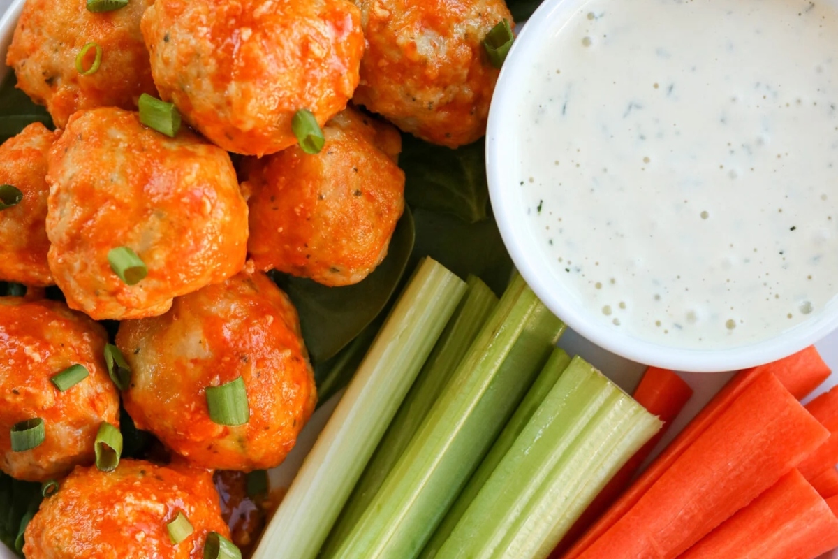 Buffalo chicken meatballs with ranch dipping sauce.