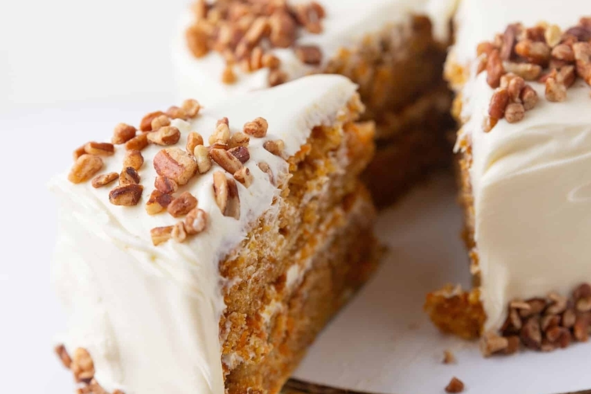 Carrot cake with cream cheese frosting and pecans.