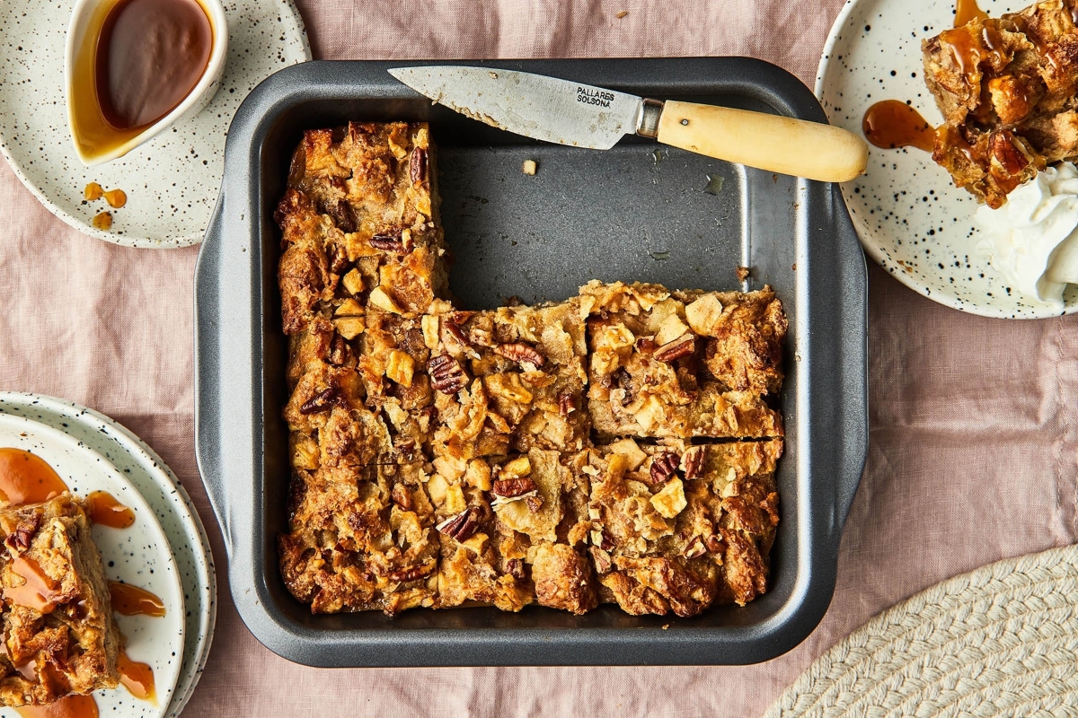 A pan with a slice of bread and a spoon on it.