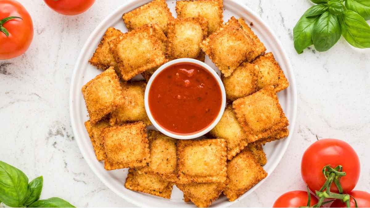 Fried ravioli with dip.
