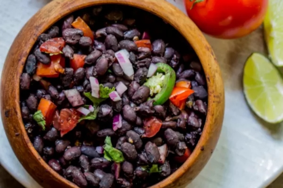 Mexican black beans in a wooden bowl.
