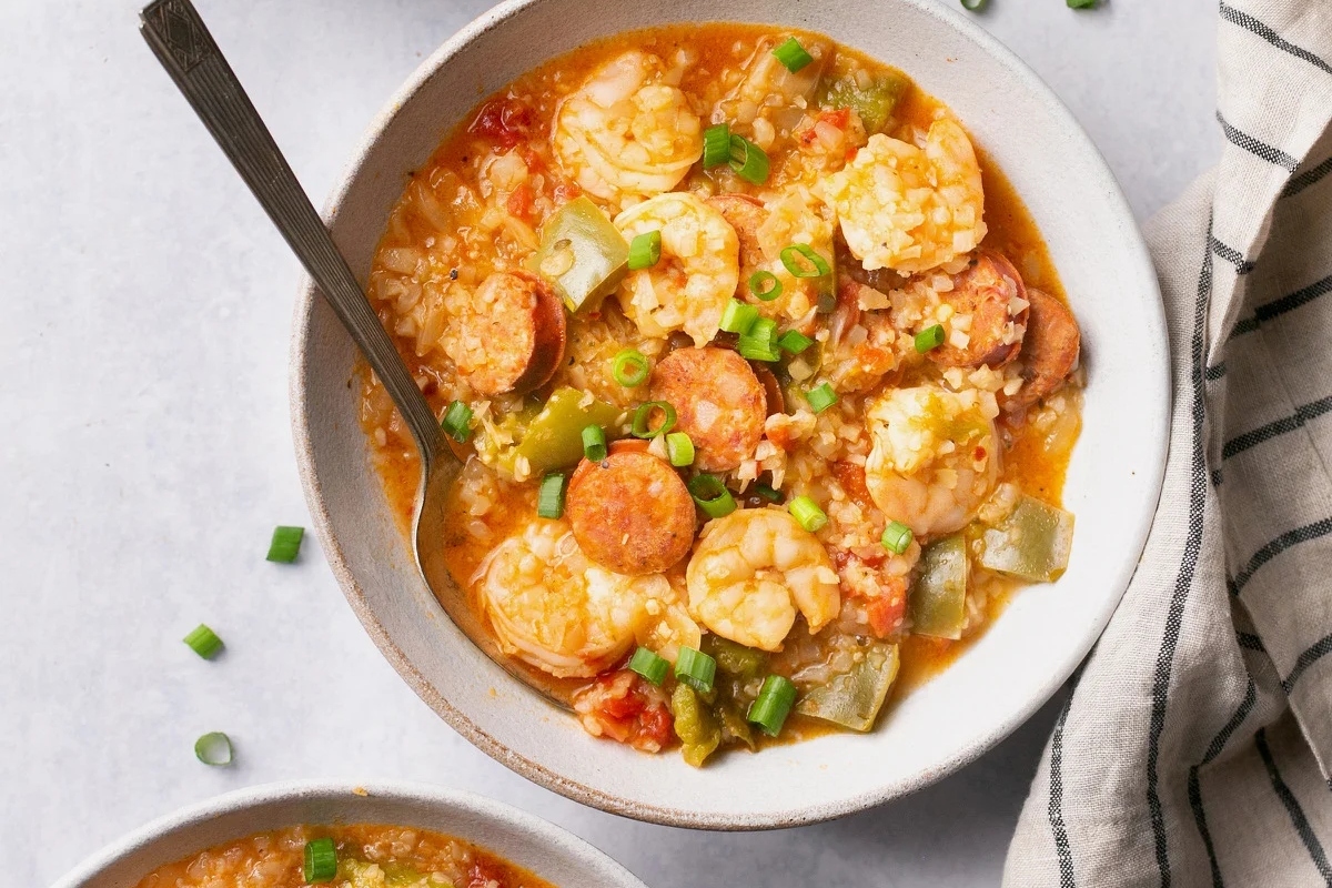 Two bowls of gumbo with shrimp and sausage.