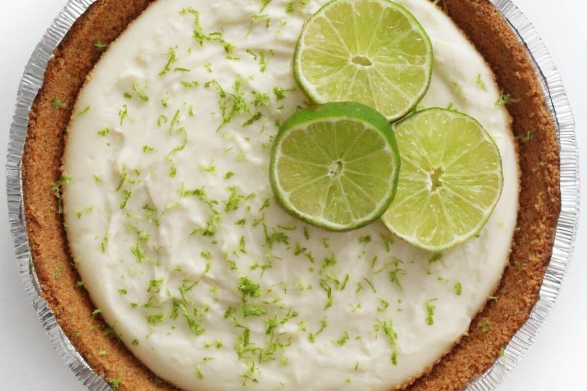 A pie with lime slices on top.
