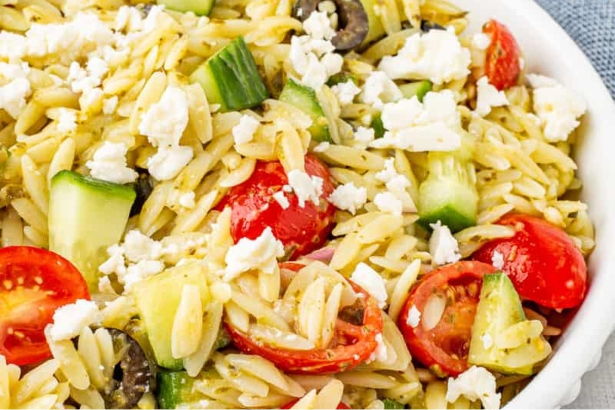 Greek orzo salad with tomatoes, cucumbers and feta cheese.