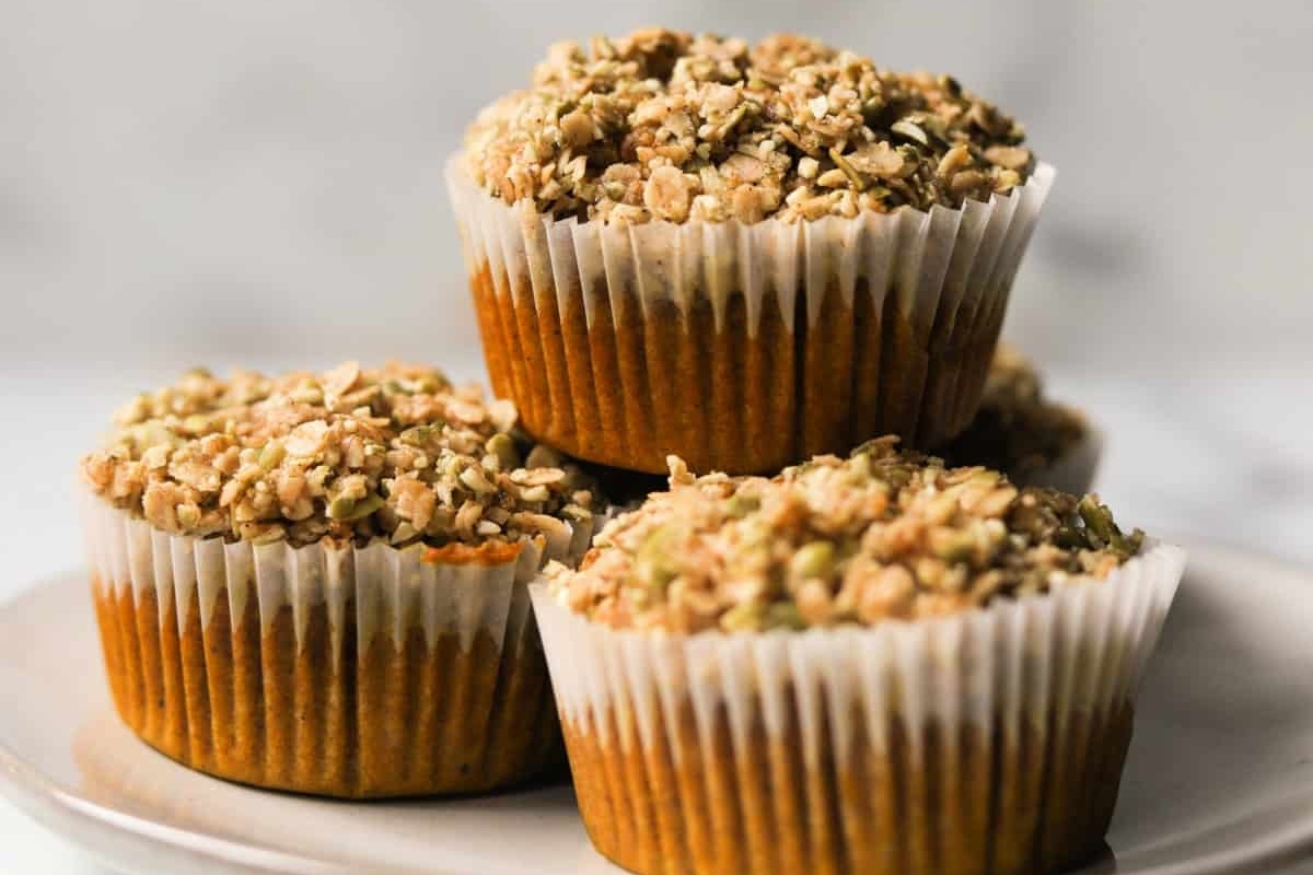 A stack of granola muffins on a plate.