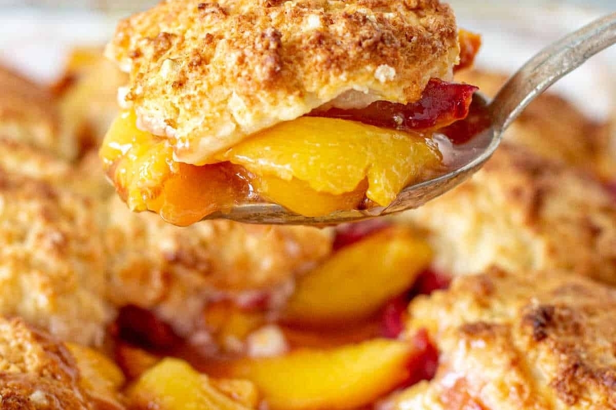 Peach cobbler on a spoon.