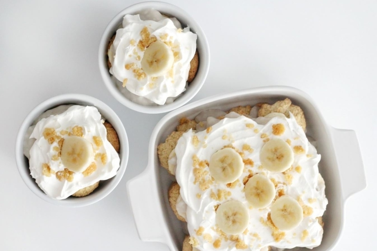 Banana pudding with whipped cream and banana slices.