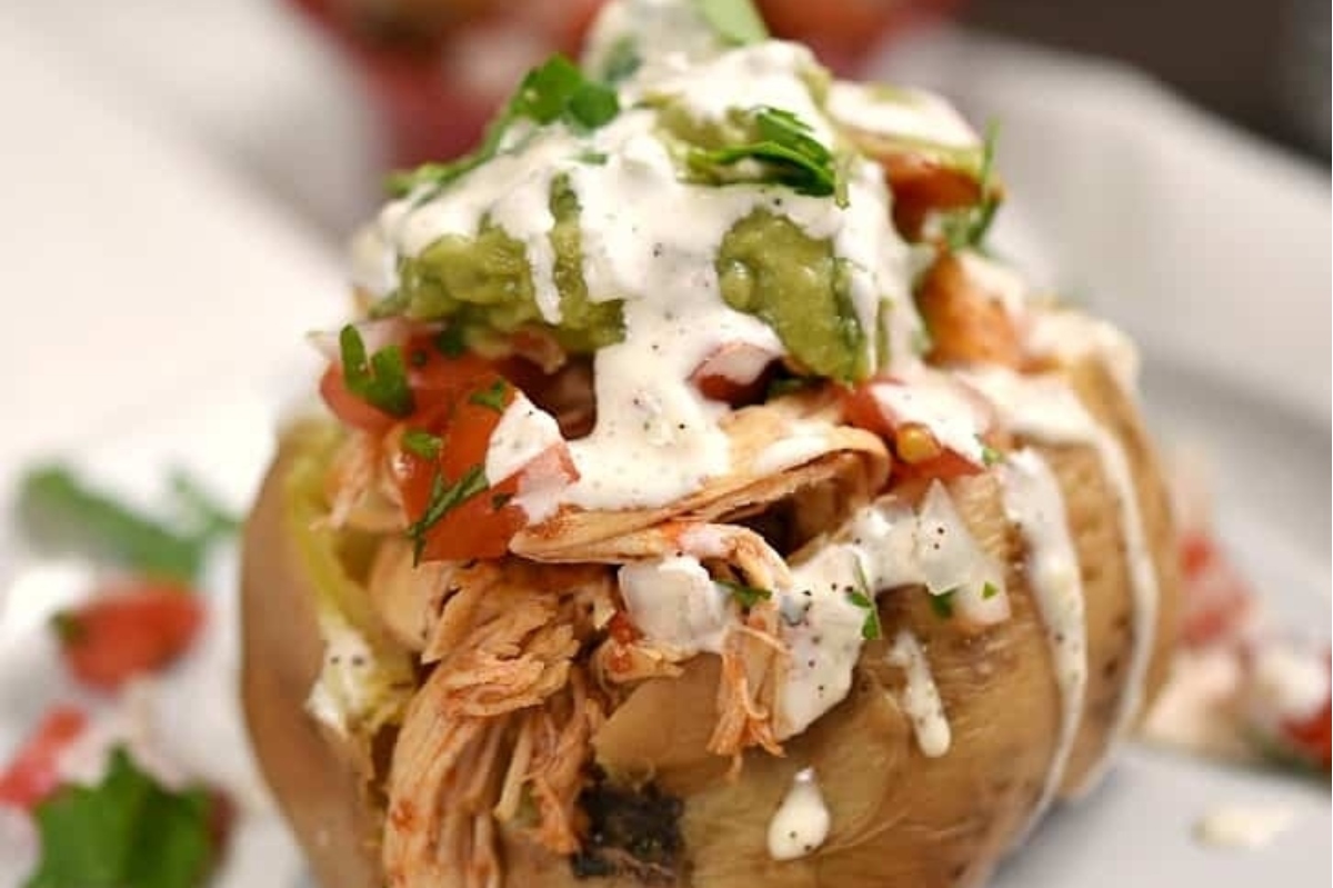 Mexican baked potatoes with guacamole and sour cream.