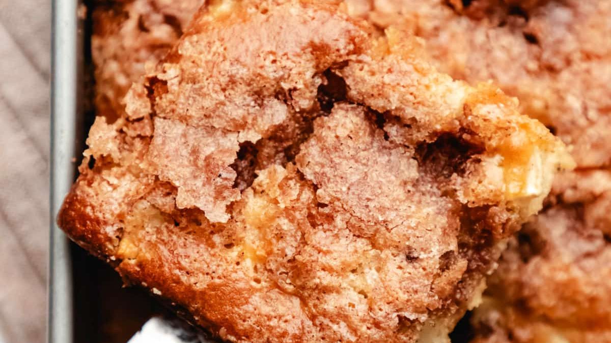 cinnamon apple cake with a slice out.