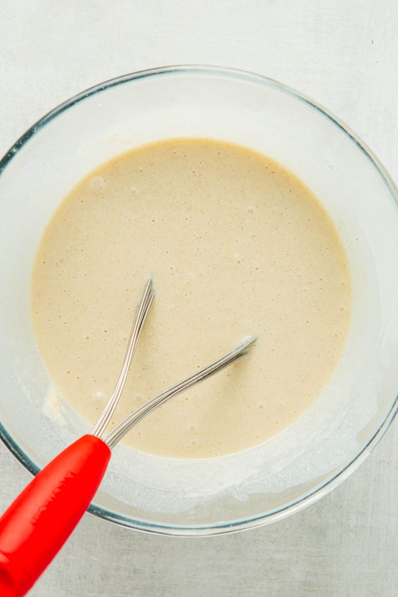 A bowl with pecan cobbler batter in it.