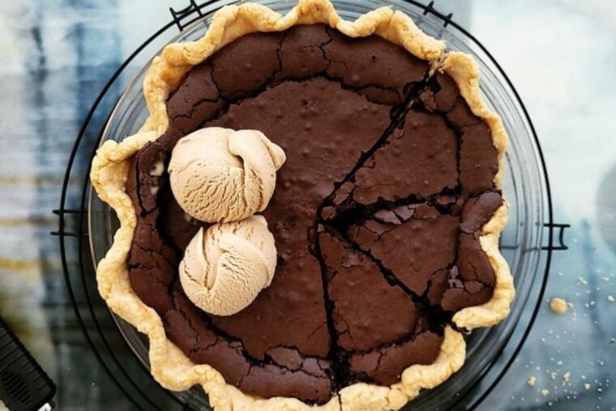 A pie with ice cream on top.