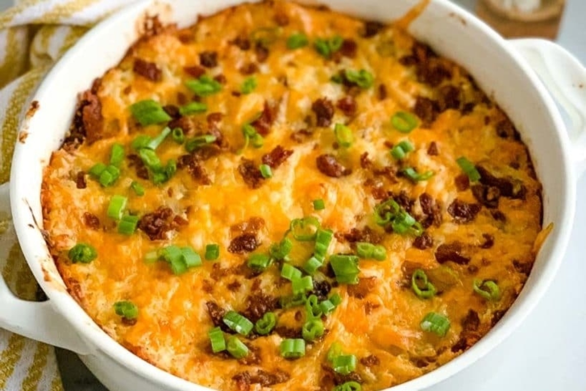 A casserole dish filled with cheese and bacon.