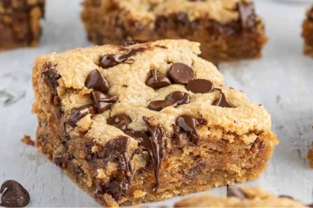 Chocolate chip cookie bars on a white background.