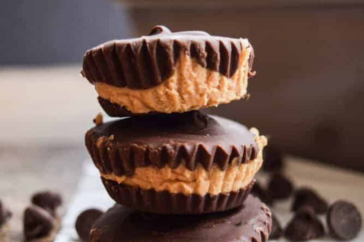 Three chocolate peanut butter cups stacked on top of each other.