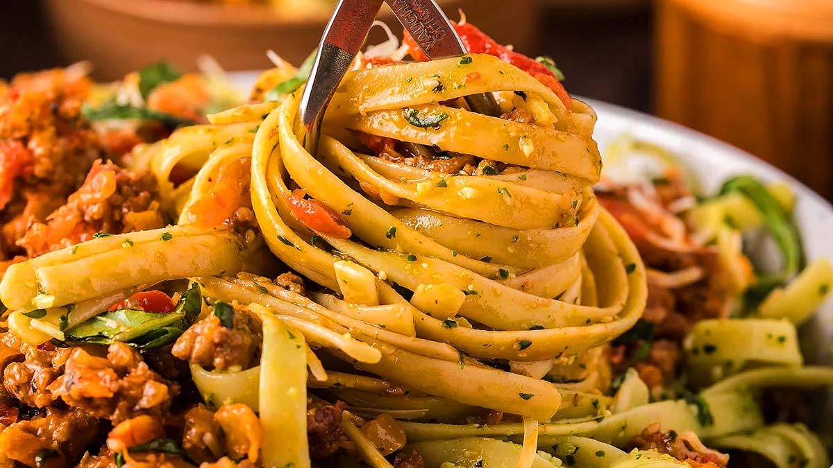 Pesto Fettuccini with Bolognese Sauce.