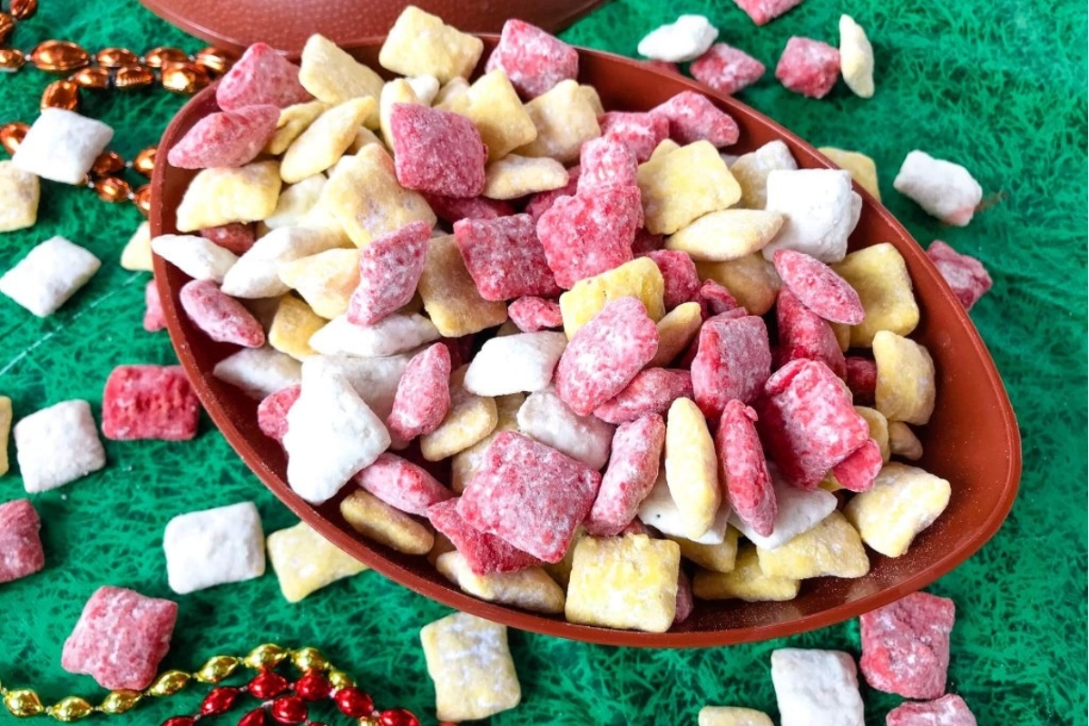 A bowl full of crinkle candy on top of a green cloth.