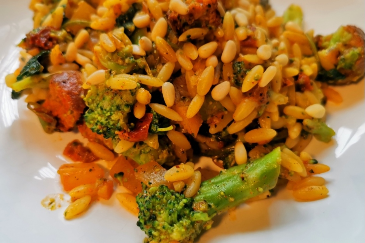 A white plate with broccoli and rice on it.