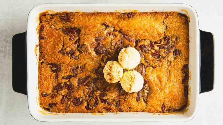 A baking dish with a pecan cobbler in it.