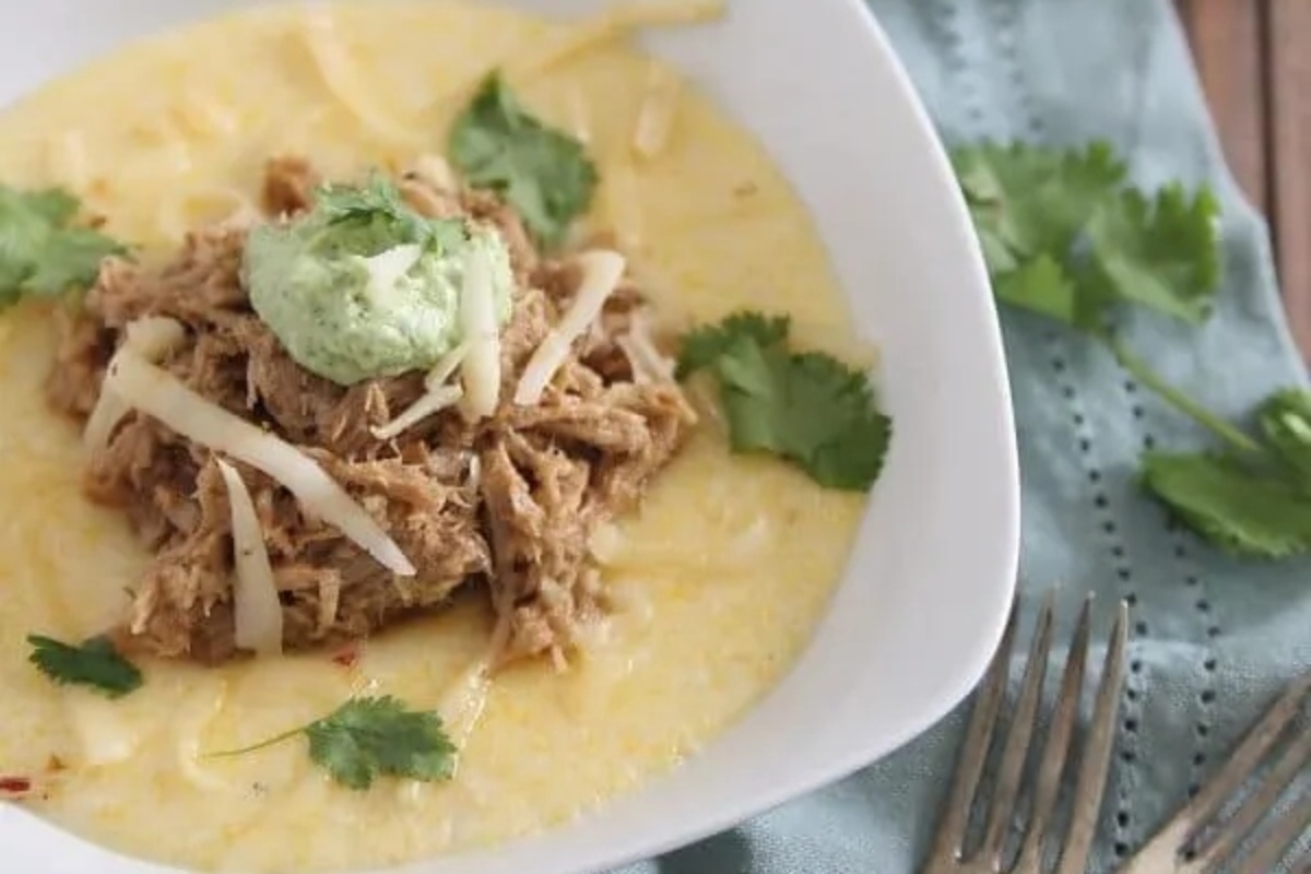 Mexican pulled pork polenta with guacamole and sour cream.