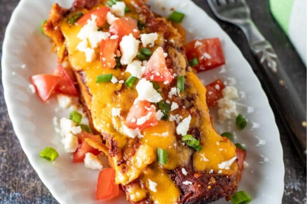 Mexican enchiladas on a white plate.