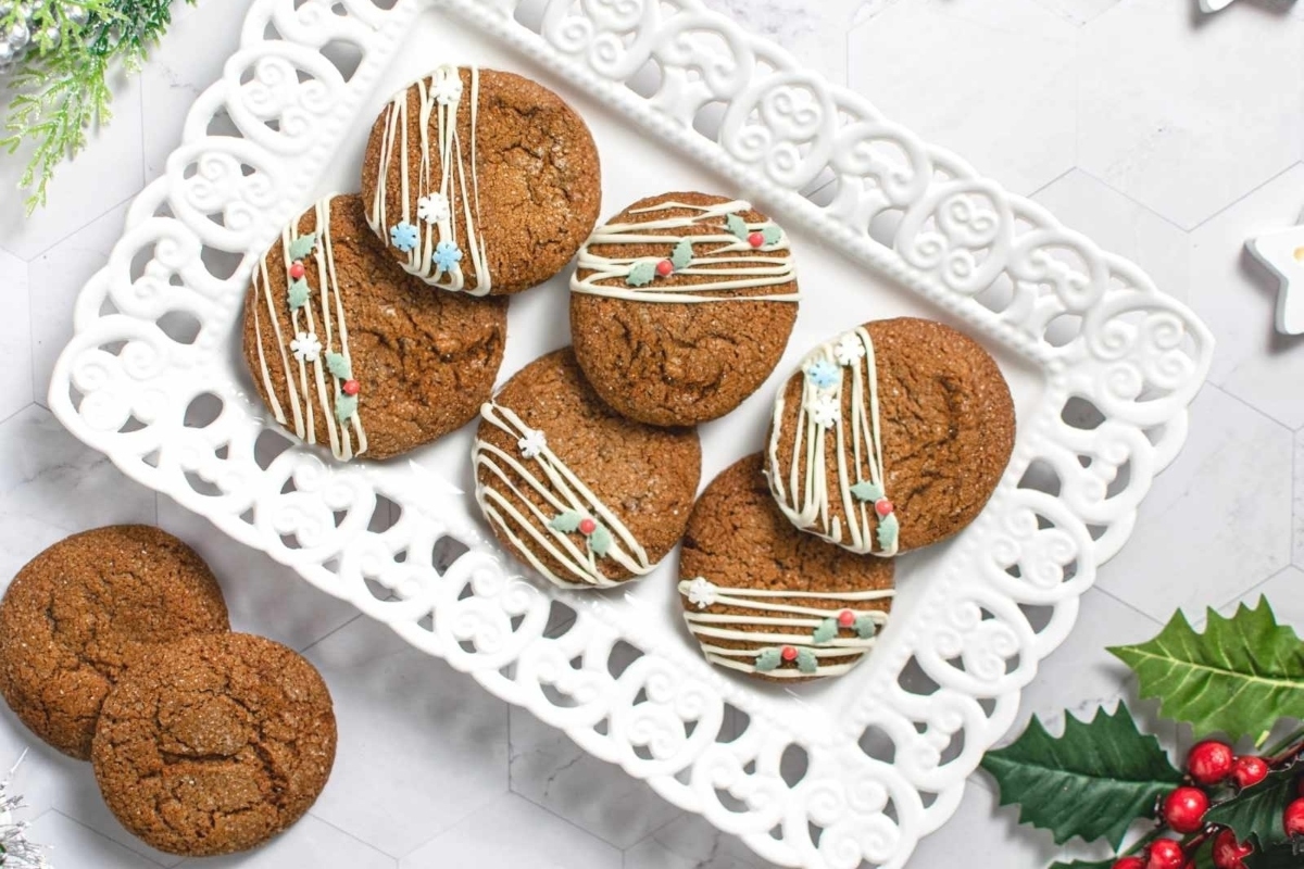 Gingerbread cookies with icing on a white plate.