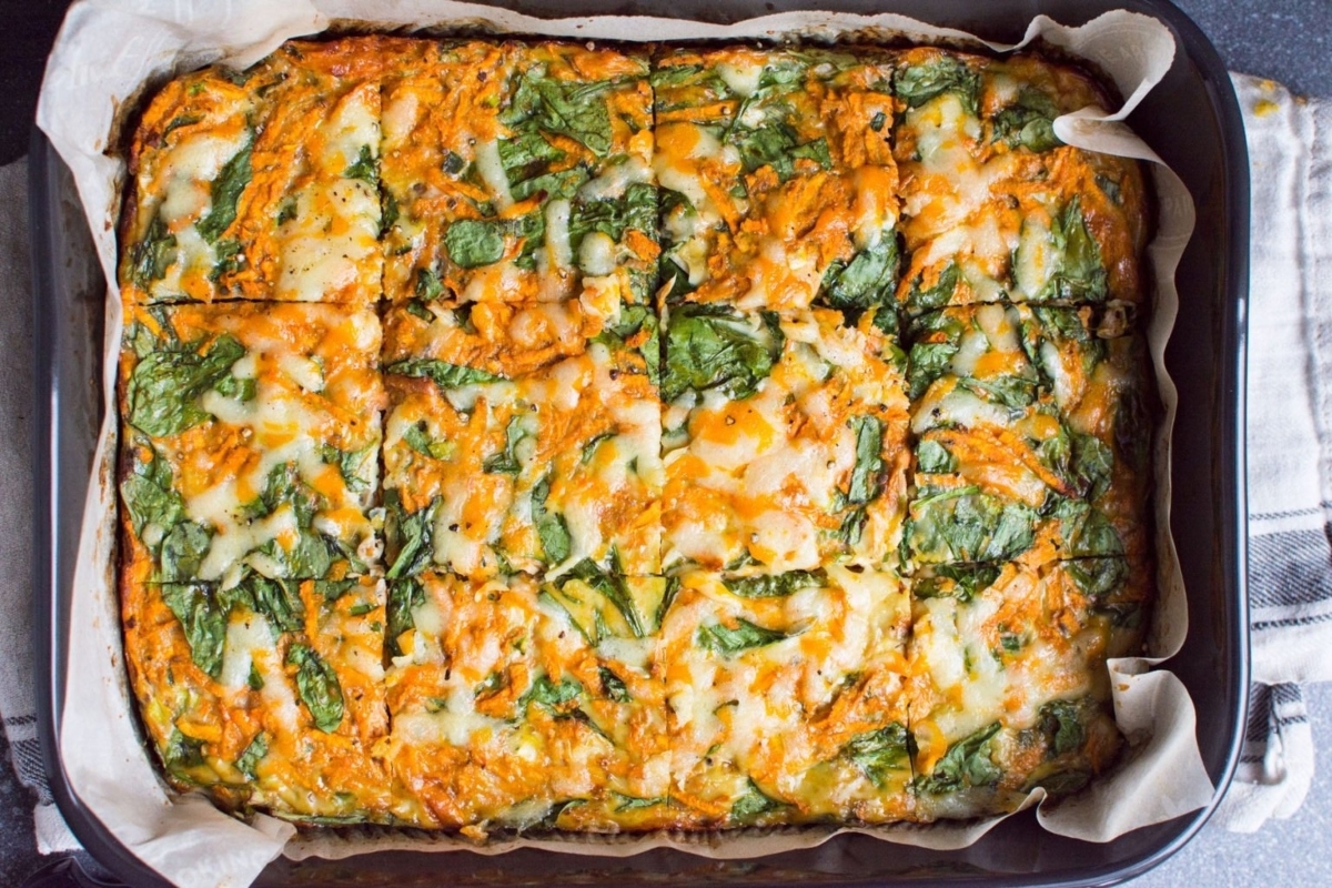 A square of spinach and cheese in a baking dish.