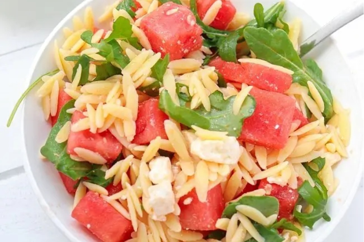 Watermelon pasta salad with feta and arugula.